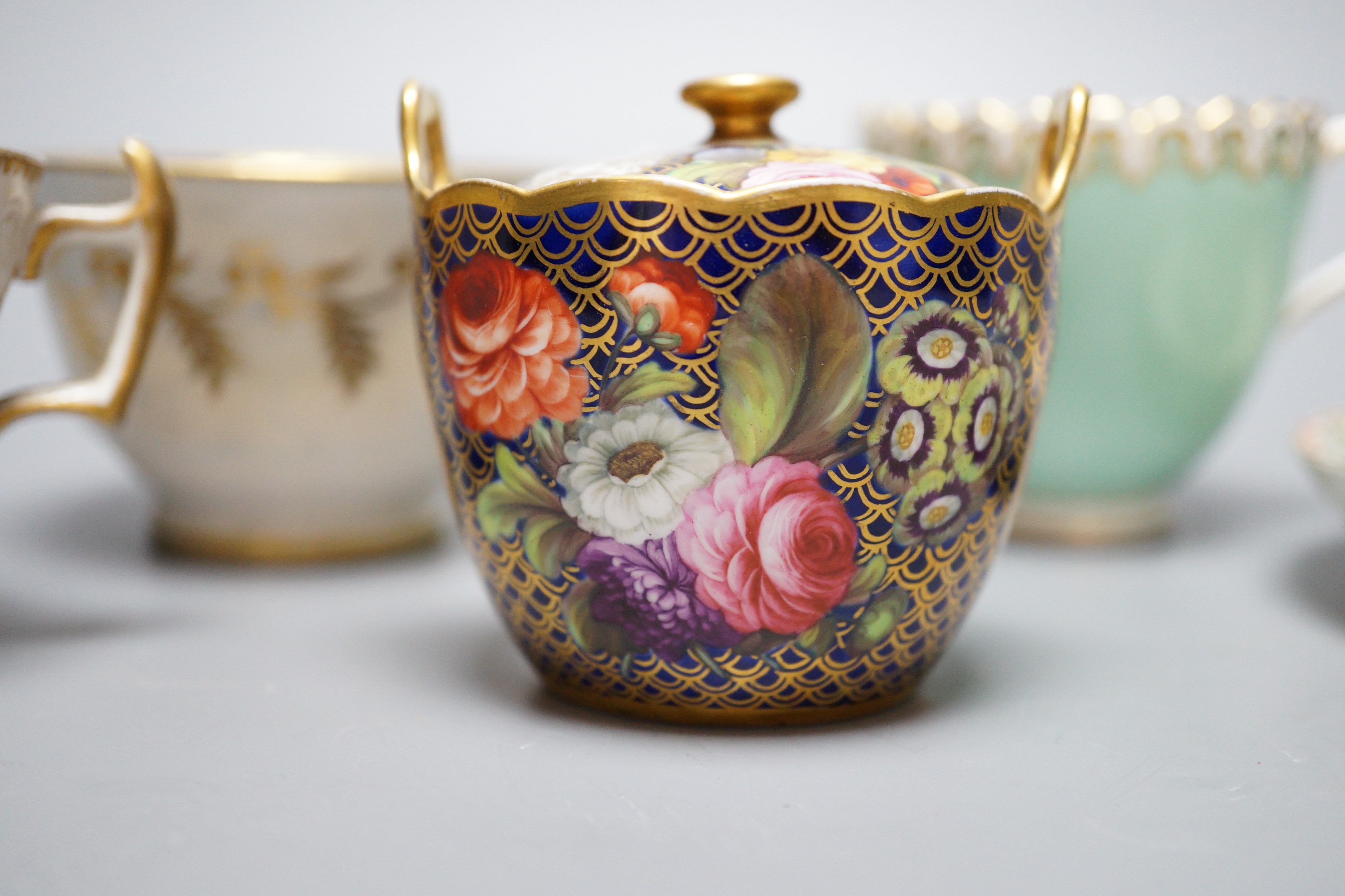 A small bone china pot pourri, possibly Spode, a relief moulded teacup and saucer, and three cups